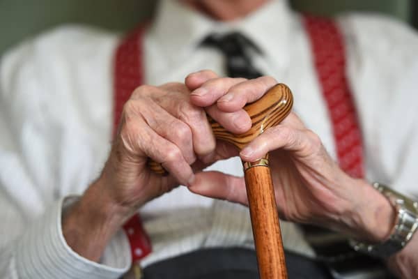 An elderly man holding a walking stick. Social workers in Scotland were forced to miss more than 30,000 days of work because of mental health issues in the last year, figures have shown. Picture: Joe Giddens/PA Wire