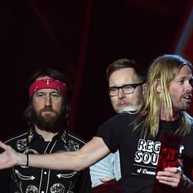 Taylor Hawkins and Dave Grohl of Foo Fighters accepting the award for Best International Group during the 2018 BRIT Awards show, held at the O2 Arena, London.