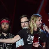Taylor Hawkins and Dave Grohl of Foo Fighters accepting the award for Best International Group during the 2018 BRIT Awards show, held at the O2 Arena, London.