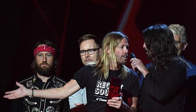 Taylor Hawkins and Dave Grohl of Foo Fighters accepting the award for Best International Group during the 2018 BRIT Awards show, held at the O2 Arena, London.