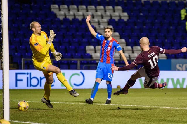 Hearts' Liam Boyce scores the equaliser at Inverness.
