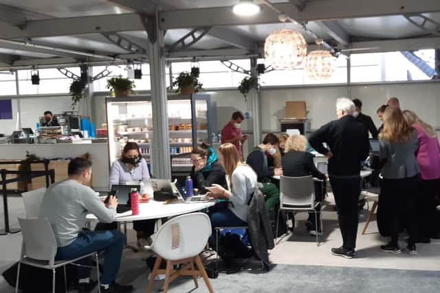 Groups of COP26 delegates informally discussing the latest developments at the conference on Saturday. Picture: The Scotsman