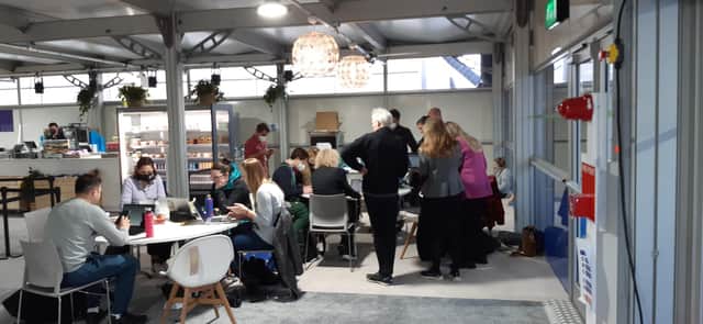 Groups of COP26 delegates informally discussing the latest developments at the conference on Saturday. Picture: The Scotsman