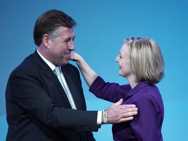 Conservative MP Sir Graham Brady congratulates Foreign Secretary Liz Truss as she is announced as the next Prime Minister at the Queen Elizabeth II Centre. She defeated rival Rishi Sunak by 81,326 votes to 60,399 to win the Tory leadership, and will replace Boris Johnson in No 10 on Tuesday.