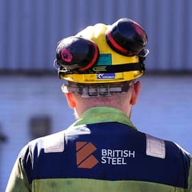 A worker stands waiting to see Chancellor Rachel Reeves during a visit to the Britiish Steel plant in Scunthorpe in April  (Picture: Danny Lawson/WPA Pool/Getty Images)