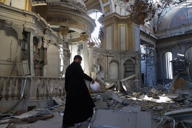 A priest examines damage to the Transfiguration Cathedral in Odesa following a Russian missile strike, July, 2023 PIC: Oleksandr Gimanov / AFP via Getty Images