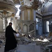 A priest examines damage to the Transfiguration Cathedral in Odesa following a Russian missile strike, July, 2023 PIC: Oleksandr Gimanov / AFP via Getty Images