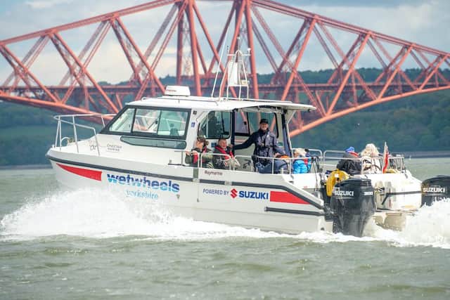 The seafaring charity WetWheels, that gives disabled people a chance to sail, has docked in Scotland for the first time.