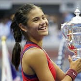 Emma Raducanu holds the trophy as she celebrates winning the women's singles final on day twelve of the US Open. Picture: PA