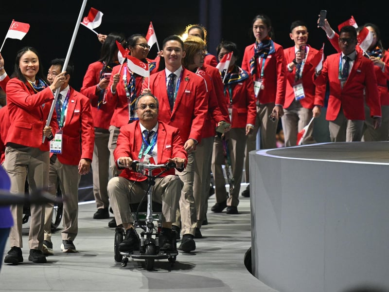 Athletes representing Singapore arrive during the opening ceremony