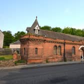 The distinctive red sandstone building at 55 Abbeyhill, Edinburgh forms the main part of the sale. Picture: Allied Surveyors Scotland Ltd