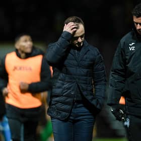 Hibs manager Shaun Maloney (centre) speaks to his assistant Valerio Zuddas after the match at Motherwell.