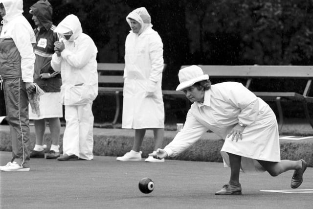Scottish bowler Senga McCrone plays her shot as the rain pours down during the bowling events in the Edinburgh Commonwealth Games 1986.