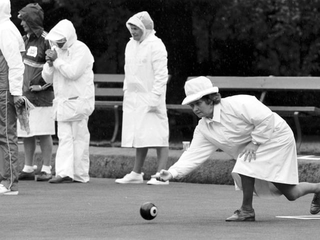 Scottish bowler Senga McCrone plays her shot as the rain pours down during the bowling events in the Edinburgh Commonwealth Games 1986.