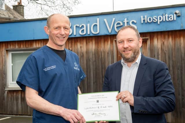 Vet Scott Dickson receiving a Community Hero Award from MP Ian Murray at Braid Vets
