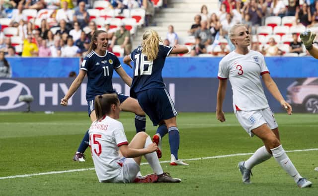 Scotland’s Claire Emslie turns away to celebrate her goal with Lisa Evans against England in the World Cup. Cr: SNS Group Alan Harvey