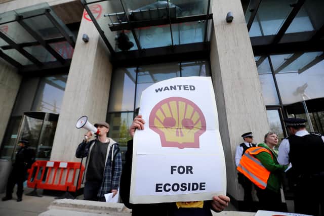 Climate change protesters demonstrate outside the UK offices of Royal Dutch Shell (Picture: Tolga Akmen/AFP via Getty Images)