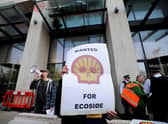 Climate change protesters demonstrate outside the UK offices of Royal Dutch Shell (Picture: Tolga Akmen/AFP via Getty Images)
