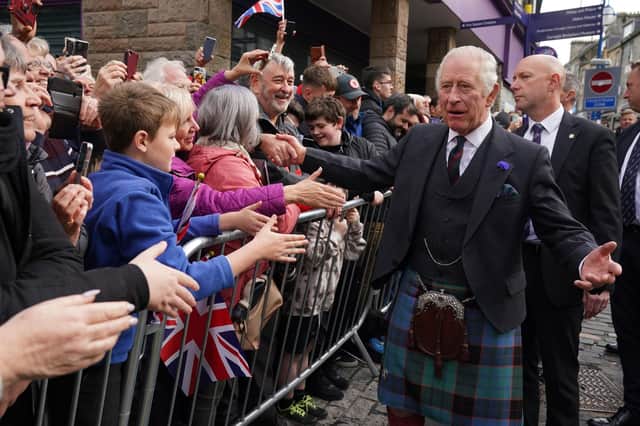 King Charles III greets members of the public after an official council meeting at the City Chambers in Dunfermline, Fife, to formally mark the conferral of city status on the former town
