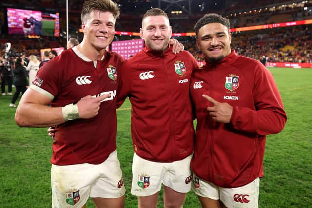 Scotland trio (from left) Huw Jones, Finn Russell and Sione Tuipulotu celebrate after the British & Irish Lions victory over Australia in the first Test match of the series. (Photo by David Rogers/Getty Images)