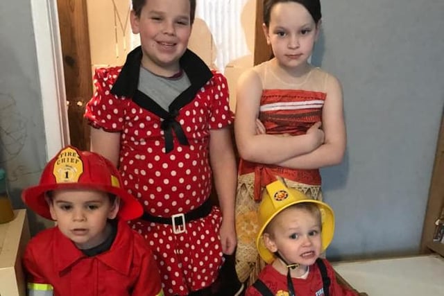 Finley, 11, as The Boy in the Dress, Maisie, 8, as Moana with Sebastian, age 4, as a fireman and Elijah, age 2, as a fire engine.