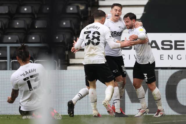 Patrick Roberts of Derby County celebrates with Jason Knight and Tom Lawrence. (Photo by Alex Pantling/Getty Images)