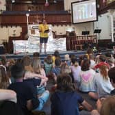 Matt Sinar, Fetteresso Church’s youth and children’s worker, talks with some of the children and leaders at one of the holiday club group sessions.