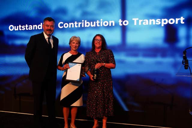 Strathclyde Partnership for Transport chief executive Valerie Davidson, centre, receiving her award from Transport Scotland interim chief executive Alison Irvine, with with Scottish Transport Awards host Grant Stott. Picture: Transport Times