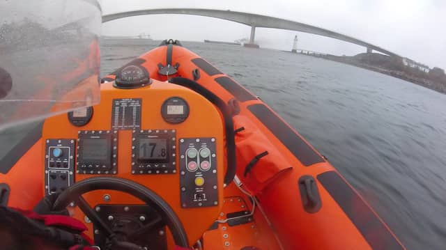 The Kyle lifeboat heads to the emergency as the cargo ship drifts towards the Skye Bridge. PIC: Contributed.
