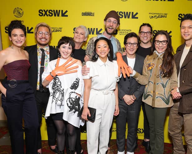 AUSTIN, TEXAS - MARCH 11: (L-R) Jenny Slate, Daniel Kwan, Tallie Mendel, Jamie Lee Curtis, Daniel Scheinert, Stephanie Hsu, Ke Huy Quan, Jonathan Wang, Michelle Yeoh and Harry Shum Jr. attend the opening night premiere of "Everything Everywhere All At Once" during the 2022 SXSW Conference and Festivals at The Paramount Theatre on March 11, 2022 in Austin, Texas. (Photo by Rich Fury/Getty Images for SXSW)