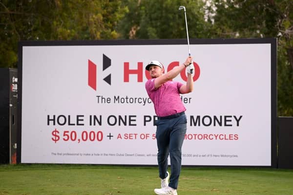Connor Syme tees off on the seventh hole during the continuation of round two of the Hero Dubai Desert Classic at Emirates Golf Club. Picture: Ross Kinnaird/Getty Images.