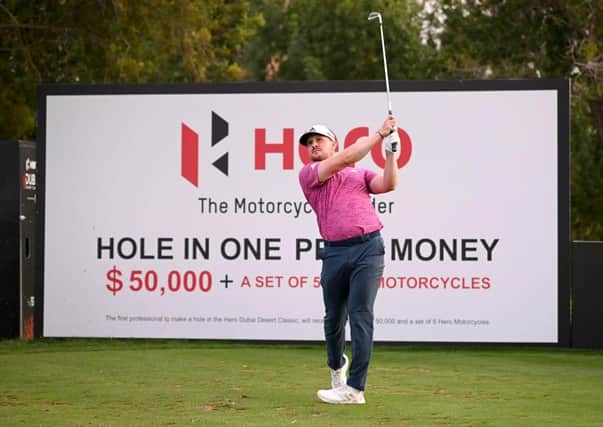 Connor Syme tees off on the seventh hole during the continuation of round two of the Hero Dubai Desert Classic at Emirates Golf Club. Picture: Ross Kinnaird/Getty Images.