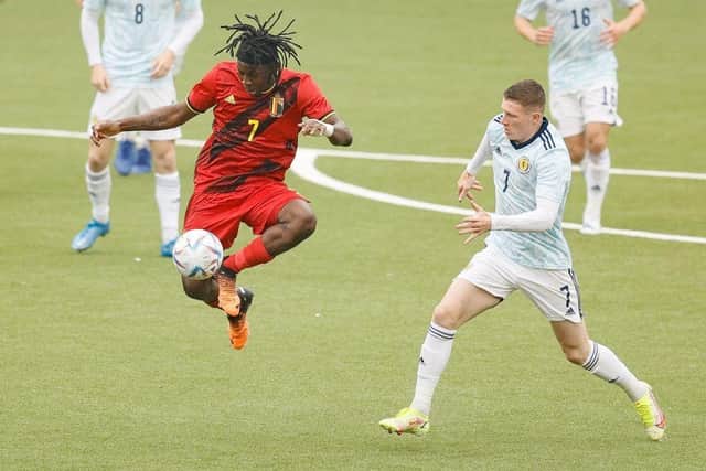 Belgium's Johan Bakayoko and Scotland's Elliot Anderson fight for the ball during the latest qualification match for the 2023 Under-21 European Championships. (Photo by BRUNO FAHY/BELGA MAG/AFP via Getty Images)