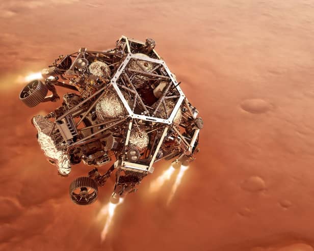 NASA's Perseverance rover firing up its descent stage engines as it nears the Martian surface. Technology made by Scottish academics will be involved in the next mission to Mars. Picture: PA