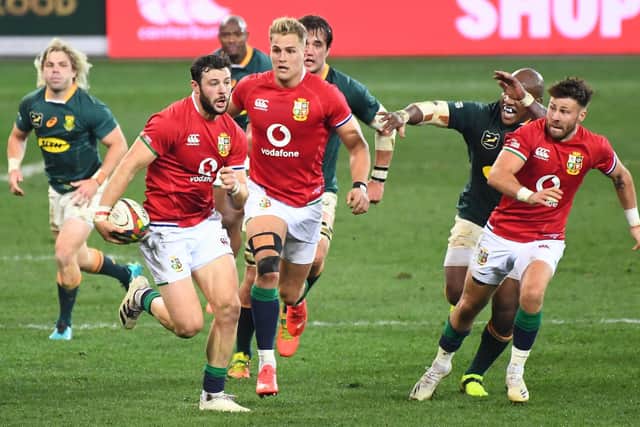 Ali Price, right, joins Duhan van der Merwe, centre, in supporting Robbie Henshaw during the British and Irish Lions' win in Cape Town. Picture: AFP via Getty Images