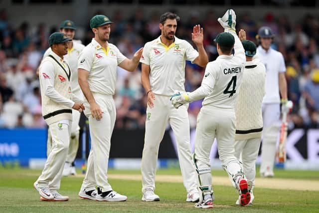 Mitchell Starc of Australia celebrates dismissing Moeen Ali of England.