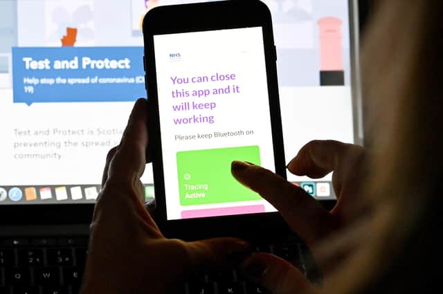 A person uses the Scottish Government's Covid-19 app. Picture: Jeff J Mitchell