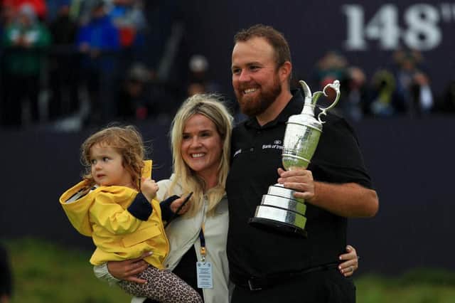 Shane Lowry celebrates his 2019 Open win at Royal Portrush with wife Wendy and daughter Iris. Picture: Mike Ehrmann/Getty Images.