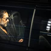 Russell Brand leaves the Troubabour Wembley Park theatre after a performance on Saturday evening. Picture: James Manning/PA Wire