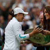 Barty receives the trophy from the Duchess of Cambridge