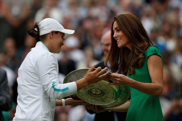 Barty receives the trophy from the Duchess of Cambridge