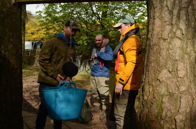 Kenny Knox, owner of Glencorse Reservoir, weighs in the catch of Nathan Johnston (right) and Scott Mathieson – who hauled in eight fish for 29lb 2oz, the biggest bag of the day. They finished second on the day after time bonuses were factored in. Picture: Nigel Duncan