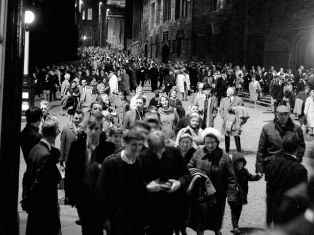 Crowds making their way down the Royal Mile after a performance of the Edinburgh Military Tattoo in August 1966.