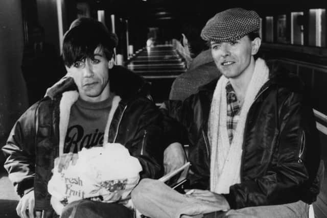 March 1977: Rock singers David Bowie, right, and Iggy Pop in Germany Photo by Evening Standard/Getty Images
