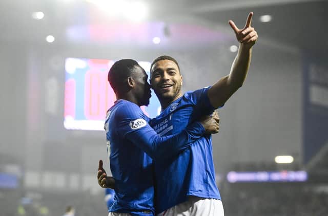 Rangers striker Cyriel Dessers celebrates with Rabbi Matondo (left) after opening the scoring in the win over Ross County. (Photo by Rob Casey / SNS Group)