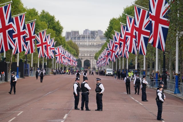 Police on The Mall ahead of the ceremonial procession of the coffin of Queen Elizabeth II, from Buckingham Palace to Westminster Hall, London, where it will lie in state ahead of her funeral on Monday. Picture date: Wednesday September 14, 2022.