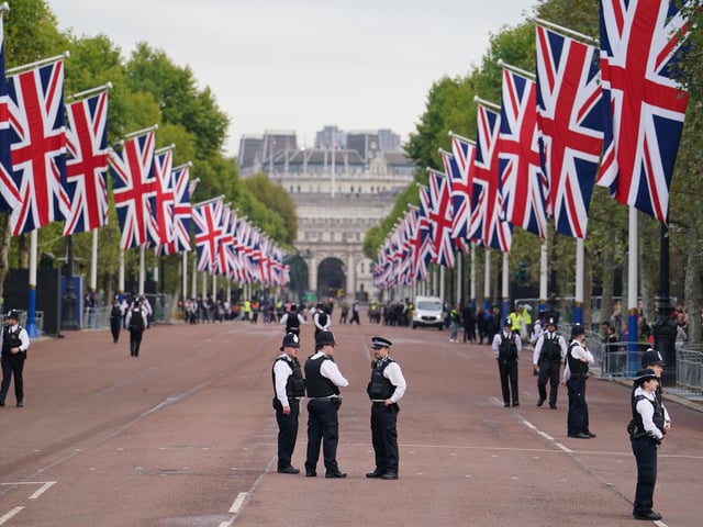 Police on The Mall ahead of the ceremonial procession of the coffin of Queen Elizabeth II, from Buckingham Palace to Westminster Hall, London, where it will lie in state ahead of her funeral on Monday. Picture date: Wednesday September 14, 2022.