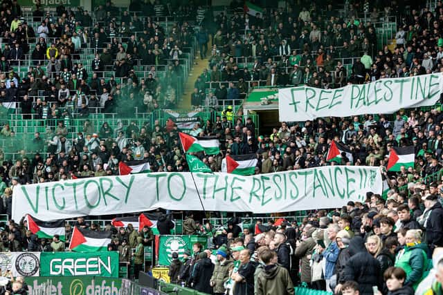 The Green Brigade hold up a banner for Palestine during the match between Celtic and Kilmarnock last weekend.