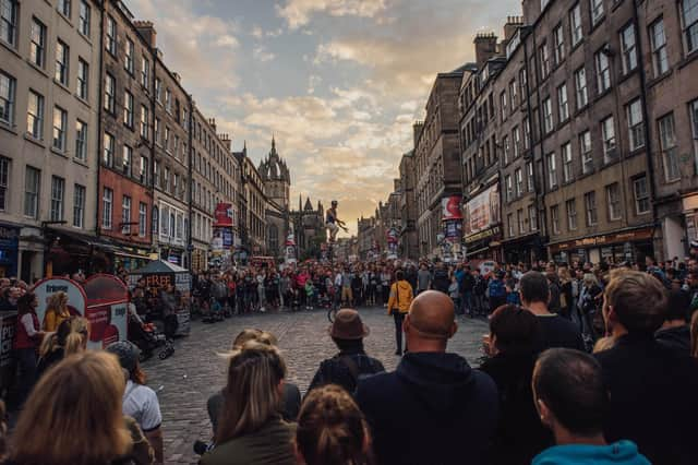 Crowds normally pack into the Royal Mile to watch street performers when the Fringe is on. Picture: David Monteith Hodge