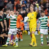 Callum McGregor, far left, takes the acclaim from the Celtic support after the win over Dundee United.